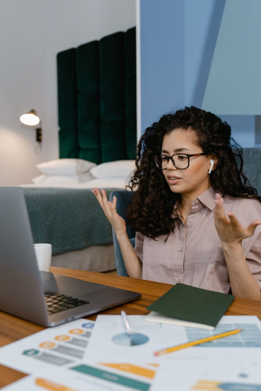 Illustrative stock photo of a woman speaking during a video call at home.